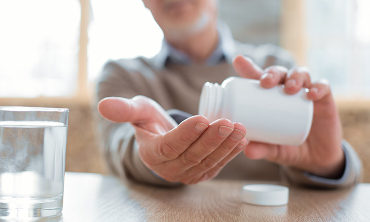 Man taking medication safely