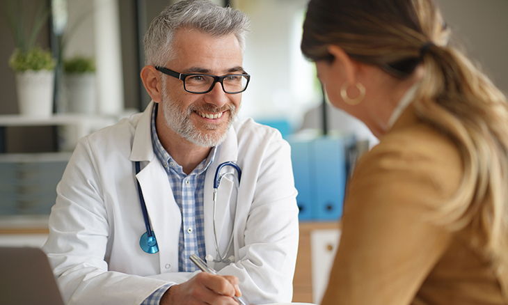A doctor speaks to his patient