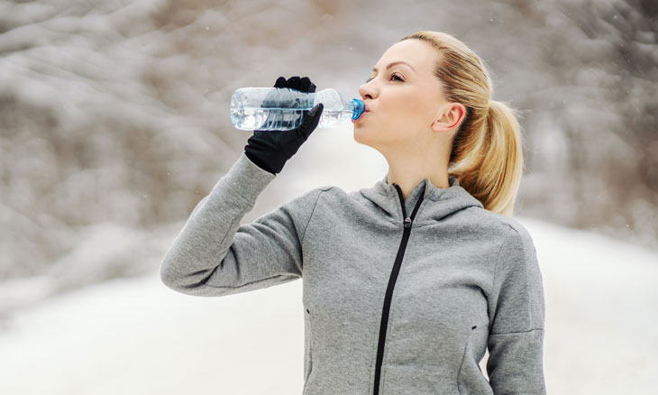Runner drinking water