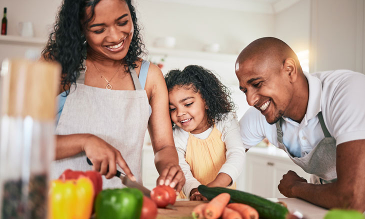 Family preparing a healthy plant based meal.