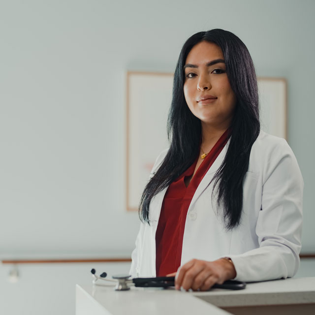 Clinician in lab coat and stethoscope