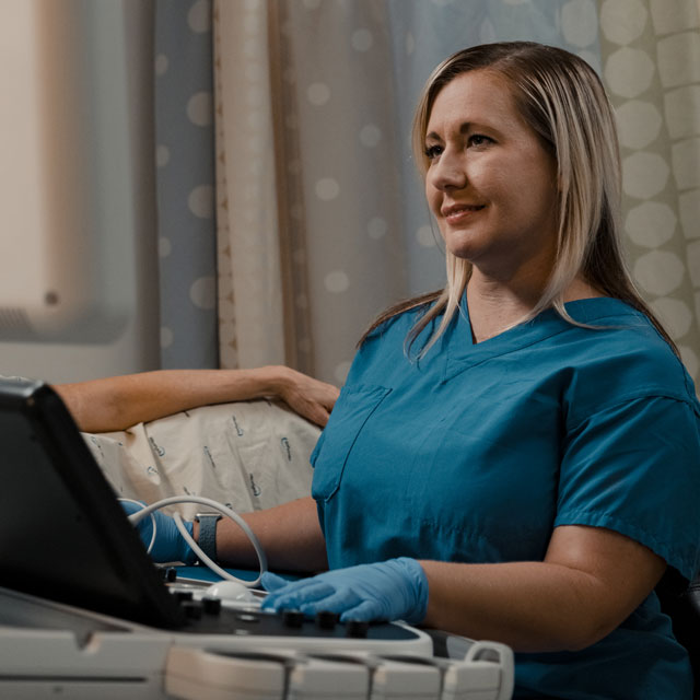 Ultrasound tech with a patient