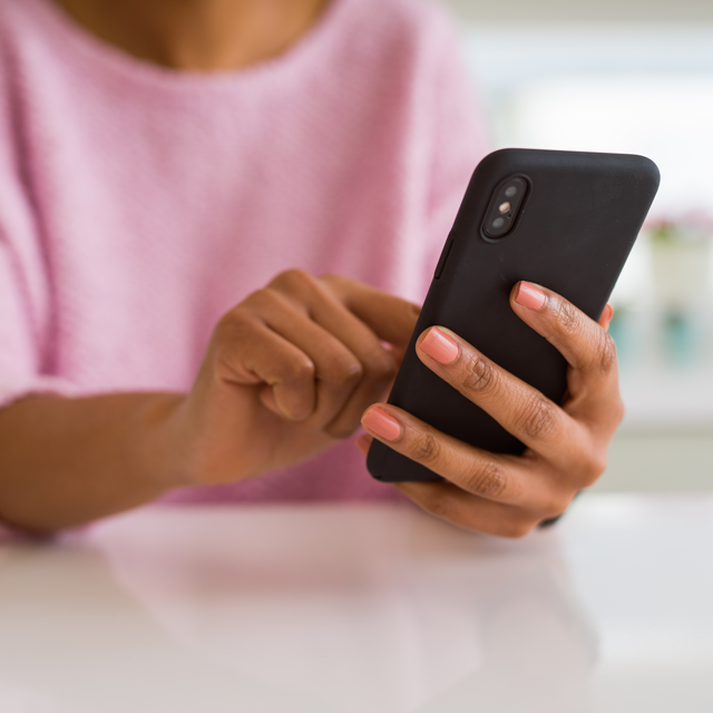 Woman scheduling her doctor's appointment on her mobile device.