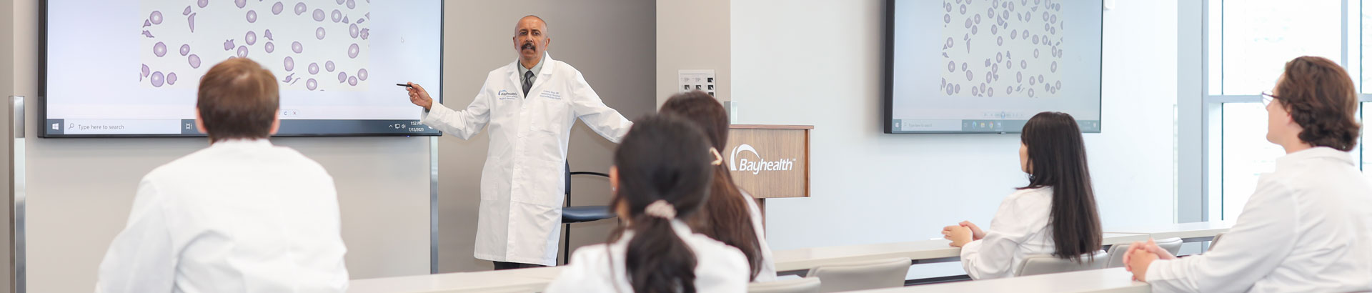 Hematology Oncology fellows listen to lecture from faculty member